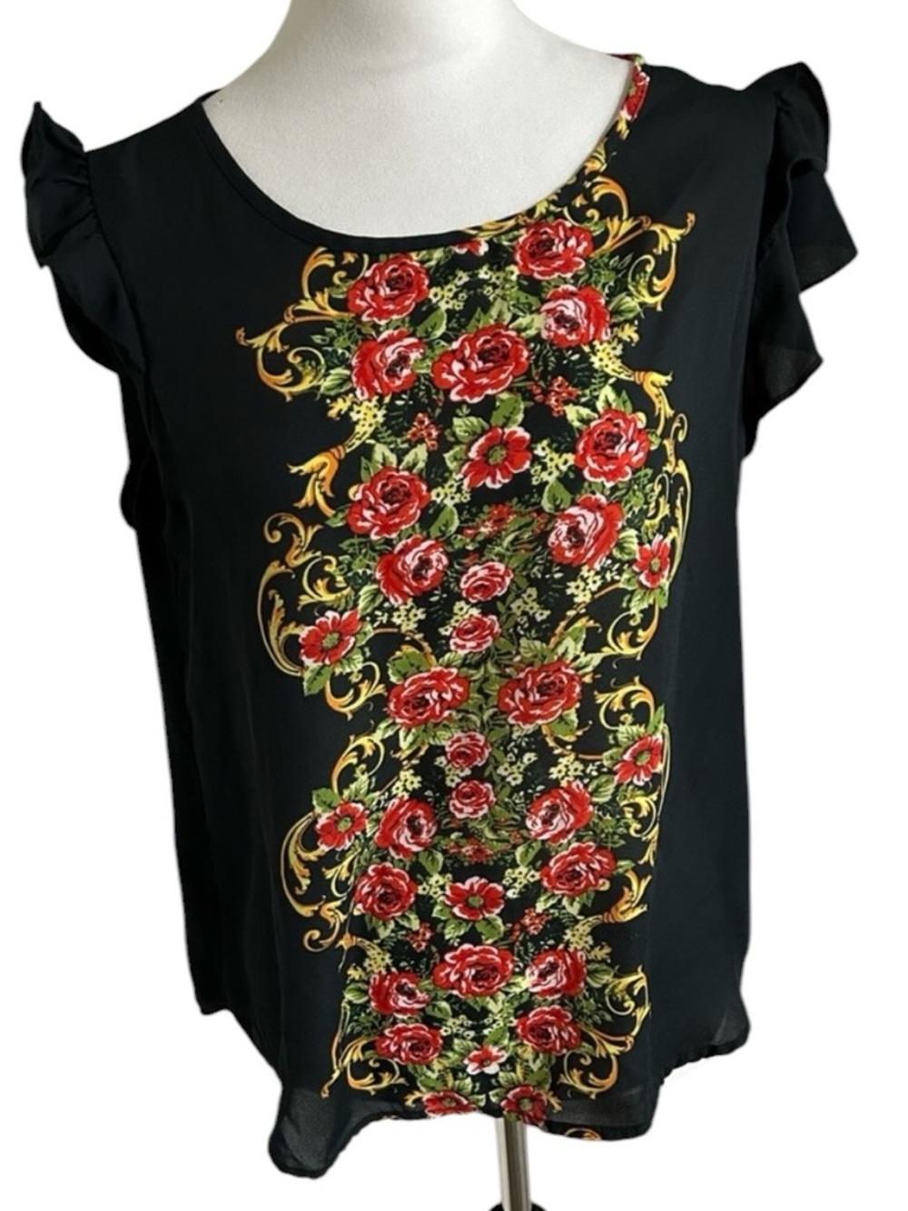 Cute OLM shirt with ruffles on the sleeves and roses down the front and back.